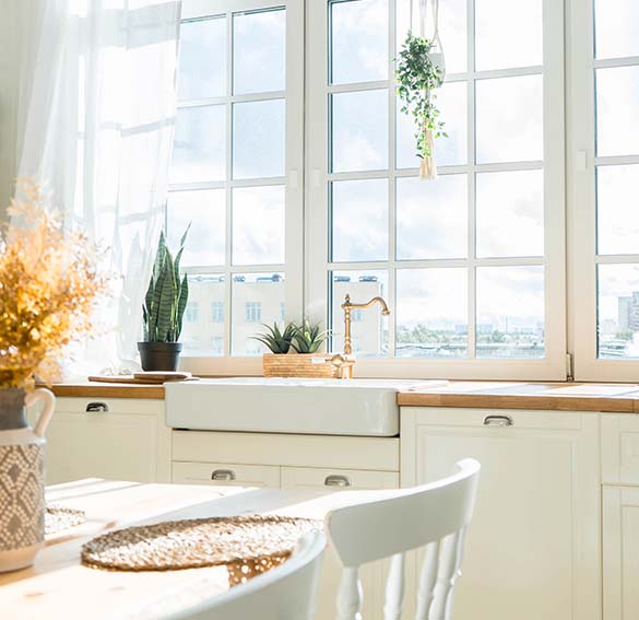 window-replacement-sarasota-fl-modern-energy-efficient-grid-windows Modern kitchen with wide, energy-efficient grid windows, an example of quality window replacement Sarasota, FL.